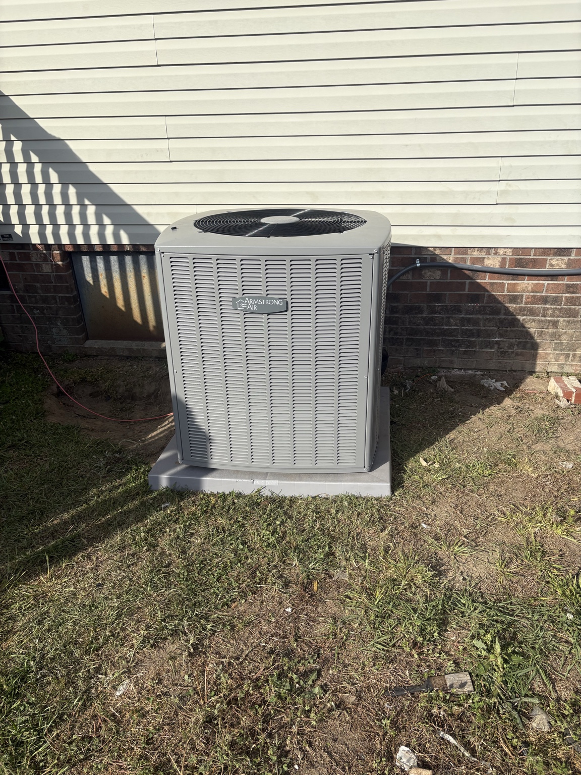 Armstrong Air residential condenser unit serviced by Barrett HVAC in Greenville, NC